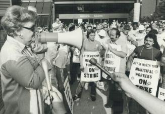 Grace Hartman, CUPE national president, tells strikers outside North York city hall today that they'll win against the politicians