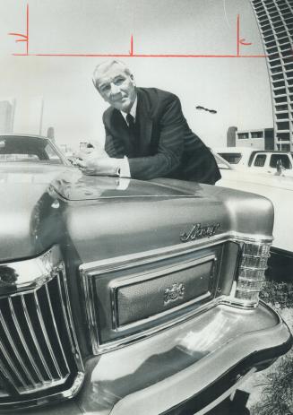 A wide-angle lens rounds out the picture of Bill Hawkins, vice-president and general manager for the Ford Motor Co