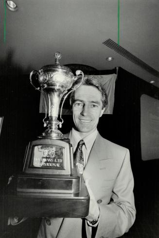 Top Prize: Jockey Sandy Hawley shows off Rothmans International trophy yesterday