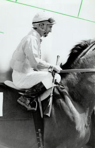 A familiar sight at the Woodbine race track is top Canadian jockey Sandy Hawley, shown here aboard No Malice