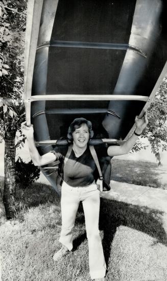Off on a 1,600-mile canoe trip to the Arctie, Alderman Katie Hayhurst of North York practises hefting a canoe and her 85-pound pack outside her home y(...)