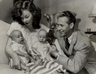 Red-headed, like their mother, Timothy and Gregory Barker, 14-week-old twins of Actress Susan Hayward and Actor Jess Barker, take their roles seriousl(...)