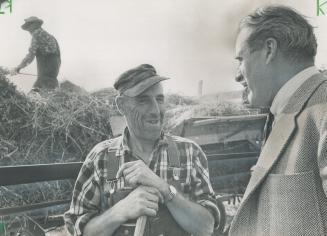 Tweed-suited Hees hops fences to shake hands with the farmers: He has the manly art of profanity to impress the workers