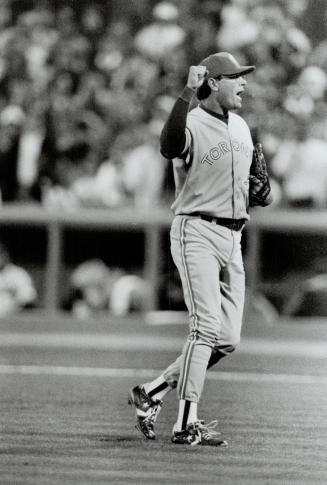 Texas-bound: Tom Henke, shown celebrating one of his many saves for Jays, will be the Rangers' stopper next season after signing three-year deal