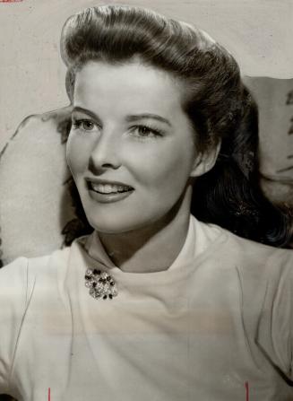 Man is said to have confessed robberies and police declare he is same fellow caught in apartment of Katharine Hepburn, shown here. Suspect is styled ''Celluloid Burglar.''