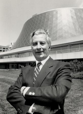 His new home: Gunther Herbig makes it official in front of Roy Thomson Hall, his new working home when he takes over as conductor of the Toronto Symphony in 1990