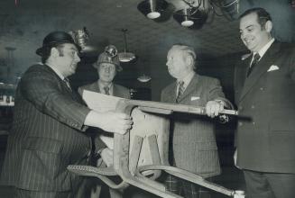 A 20-year customer of the Honey Dew restaurant at Yonge and Carlton Streets, broadcaster Foster Hewitt (second from right) paid $2.99 for this souveni(...)
