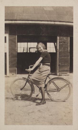 Mary Gemmell on a bicycle