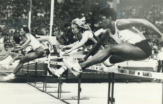 Stephanie Hightower of the United States, third from right, leads the 50-yard hurdles on her way to victory in a time of 6.41 seconds