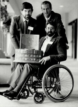 Award winners: Dr. John Scott, left, Carl Hiebert, centre, and Peter Dalglish are three of the five winners of the 1986 Vanier Awards. They'll be honored at a Sheraton Centre dinner tonight