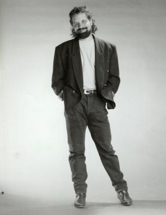 Casual: Singer Dan Hill dresses down his cashmere jacket with sweatshirt, boots