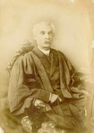 Abbott family photograph album. Photograph 27. Anderson Ruffin Abbott seated, in academic robes