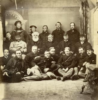 Image shows a group of people in three rows posing for a photo.