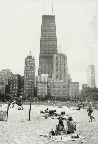 Chicago Beaches are in the shadow of some of the world's tallest buildings and with easy walking distance of major hotels. The John Hancock Centre, above is the world's fifth talles. Tenants occupying upper floor suites sometimes wake to sunshine and find clouds down below.