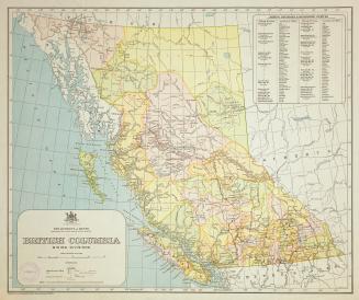 A printed map of British Columbia, where different colours indicate mining divisions.
