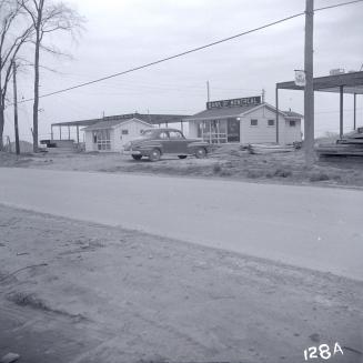 Temporary ''frontier style'' wooden shacks of the Bank of Montreal and the Bank of Nova Scotia on the south side of Lawrence Avenue East