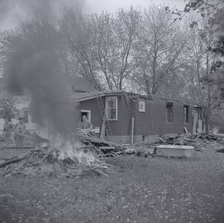 Holmes Avenue dwelling being dismantled and burned for expansion of Willowdale Baptist Church,  ...