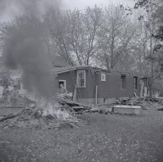 Holmes Avenue dwelling being dismantled and burned for expansion of Willowdale Baptist Church, …