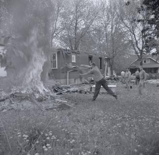Burning scrap Rev. Paul T. Holiday, incumbent at Willowdale Baptist Church, Toronto, Ontario. I ...