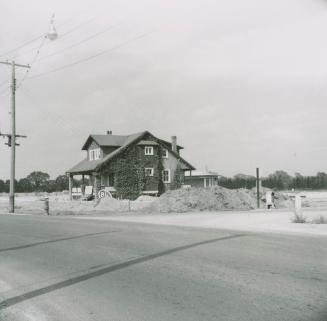 House and service station on the northeast corner of Leslie Street and York Mills Road