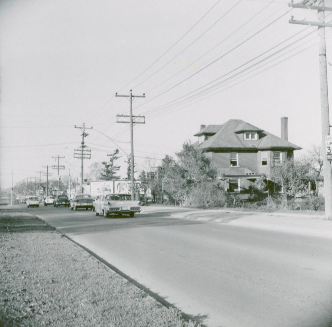 Looking north on Yonge Street from south of Cummer Avenue and Drewry Avenue at large house on the southeast corner of Yonge and Cummer