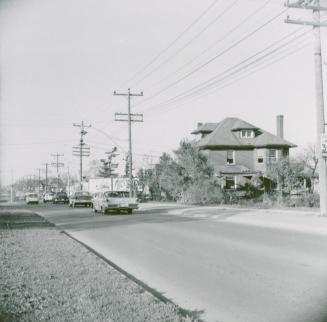 Looking north on Yonge Street from south of Cummer Avenue and Drewry Avenue at large house on the southeast corner of Yonge and Cummer