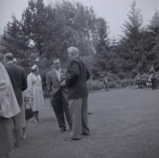 Image shows people gathered for an opening of the Edward Gardens.