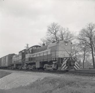 C.P.R., Lambton yards, north of Lambton Park, east of Humber River, showing diesel #7107 at front & #7100 behind. Toronto, Ontario