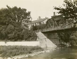 Old Dundas St., bridge over Humber River, looking east, showing Lambton Flour Mills. Toronto, Ontario