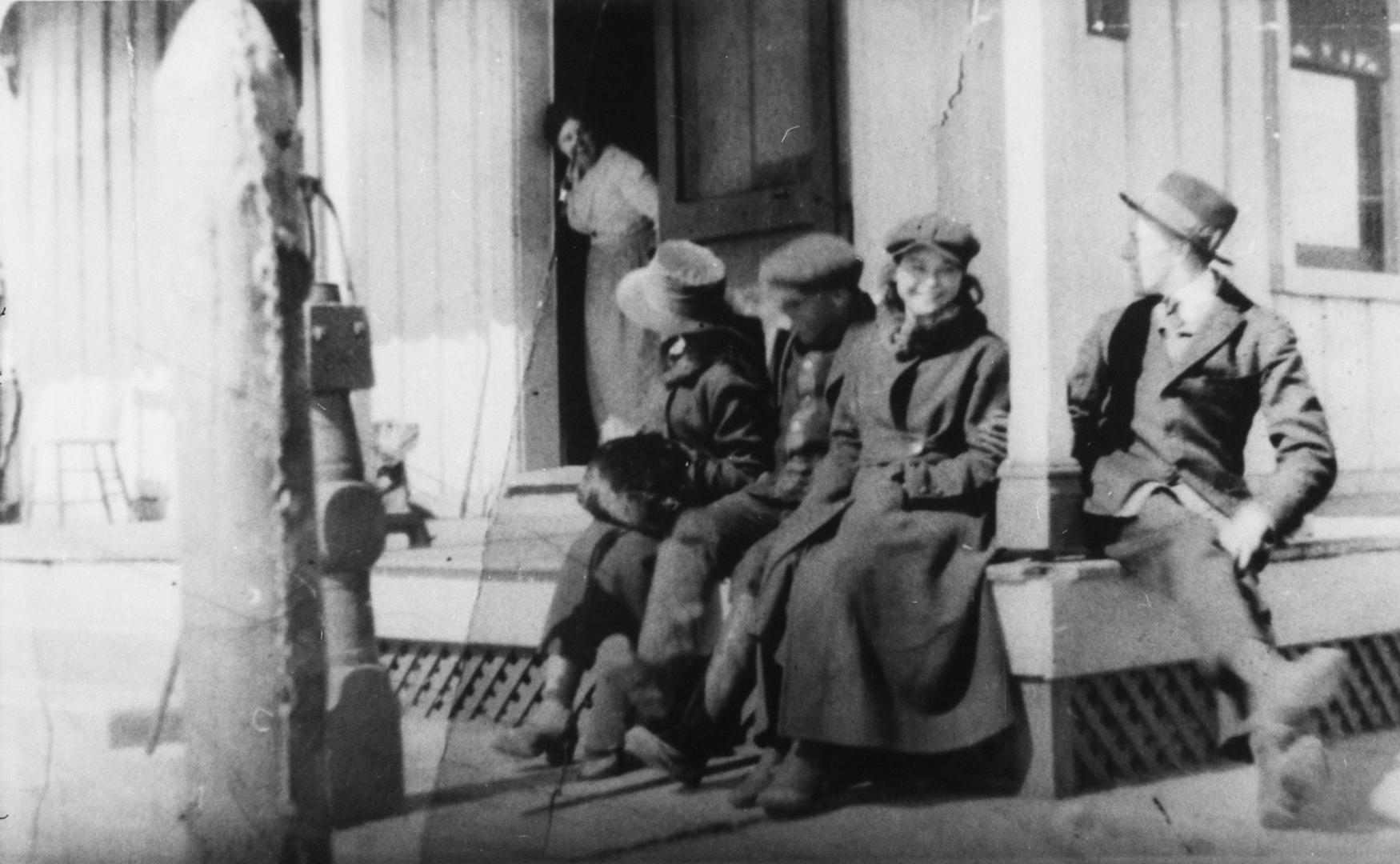 People seated on the verandah of O'Sullivan's Hotel