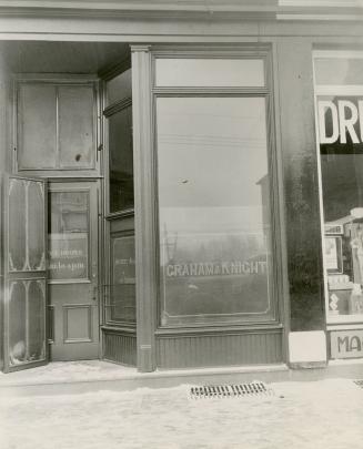 Photograph of a storefront with the words Graham and Knight on the shop window.