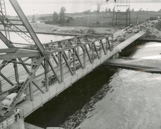 This is a section of a Bailey bridge which can be erected quickly, and handle steady flow of traffic