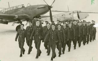 Wings parade: 1944 photo at Camp Borden has young Canadians who got their flying training under the Commonwealth Air Training Plan marching past a Fairey Battle (left) and twin-engine Oxford trainer