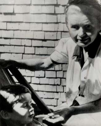 Rudolf Hess's wife and eight-year-old son Wolf-Ruediger are seen on the porch of the Bavarian home in Bad Oberdorf where they recently were found by the Allies