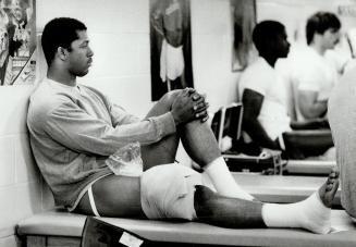 Speed merchant Sterling Hinds, a former Olympian, nurses his tender right knee with icepack
