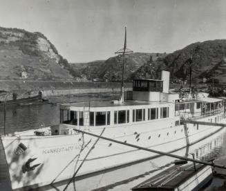 Hitler's Launch, the Hansestadt, which was presented to him by the city of Cologne, is seen here riding at anchor in the now quiet waters of the Rhine(...)