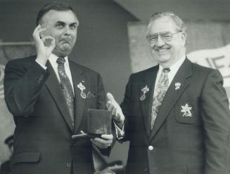 Governor-General Ray Hnatyshyn, left, seems mighty pleased with the official Canadian National Exhibition medal, engraved with his portrait, being pre(...)