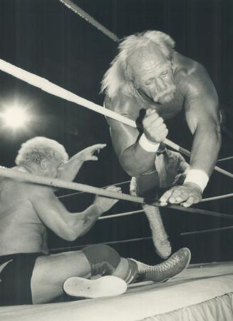 Hulkster deposes the 'King': Heavyweight champion Hulk Hogan is sent flying into the ropes by the 'King': Handsome Harley Race during title bout last night at Maple Leaf Gardens