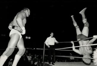 The topsy-turvy world of wrestling: The bell hadn't even sounded last night and these two behemoths of wrestling were already at each other's throats