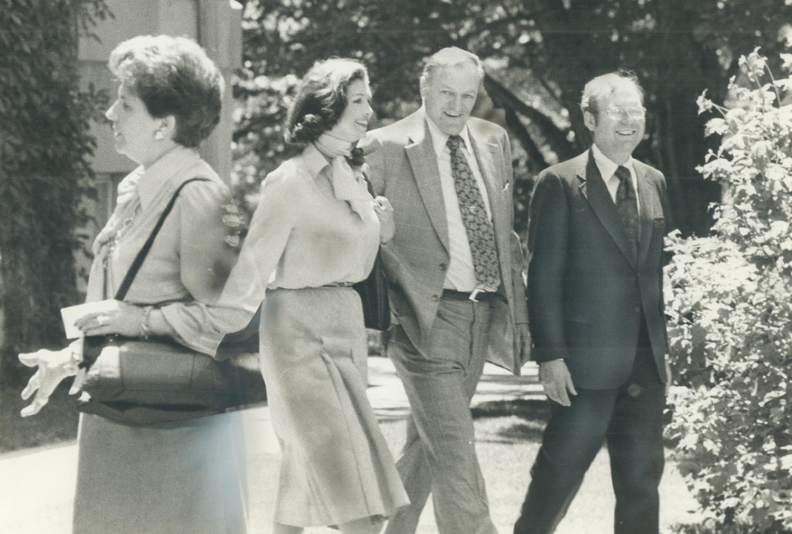 Sunny sign-out: Defeated Liberal cabinet ministers Iona Campagnolo: Jack Horner and Otto Lang stroll in the sunshine after packing up and moving off Parliament Hill yesterday