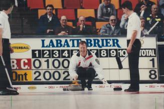 Howard puts B.C. behind the 8 ball. The score says it all - and so does the smile on Ontario skip Russ Howard's face. Howard: ahead 8-1 at one time: f(...)