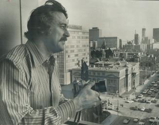 Surveying Toronto from the roof of the Park Plaza Hotel yesterday uring trip to promote his latest movie is new hairy Rock Hudson. In Pretty Maids All(...)