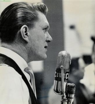 Tommy waiting for his cue during a radio broadcast