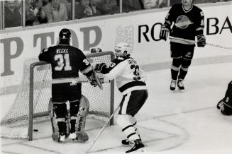 Seemed like years for weeks: Al Iafrate: who assisted Lou Franceschetti on Leafs' first goal of the night and gave a solid efford: is glas to see the puck behind Vancouver goalie Steve Weeks