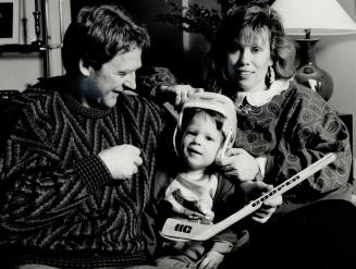 At home in Canada: Peter Ihnacak enjoys some time away from the rink at home wtih wife Debora and son Brian, who will be 2 in April