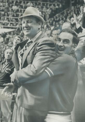 Vengeance is sweet for hockey coach Punch Imlach - fired as general manager and coach of Toronto Maple Leafs - as he is hoisted triumphantly into the (...)