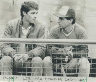 The Royals' Dane Iorg, left, and his Blue Jay brother Garth chat before Game 3