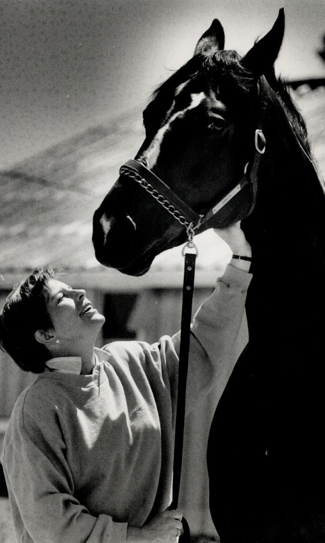 Great Partnership, Cindy Ishoy, Canada's best hope for a medal in the equestrian dressage event at the Seoul Olympics, talks to her partner in the spo(...)