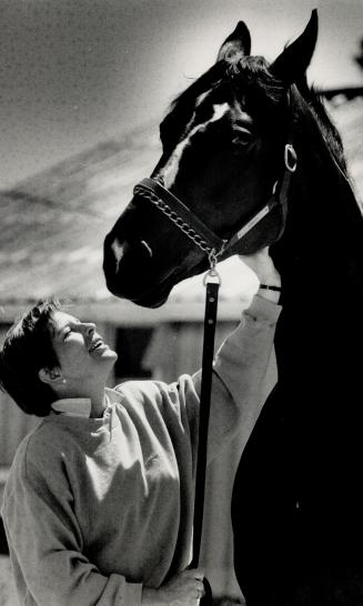 Great Partnership, Cindy Ishoy, Canada's best hope for a medal in the equestrian dressage event at the Seoul Olympics, talks to her partner in the spo(...)