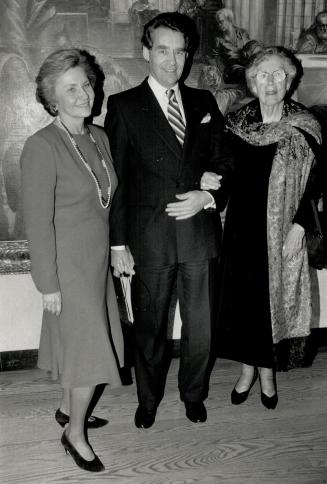 Far left: Mary Frances Hendrick in a red wool dress by Belleville Sassoon with Eric Jackman, and his mother, Mary Jackman